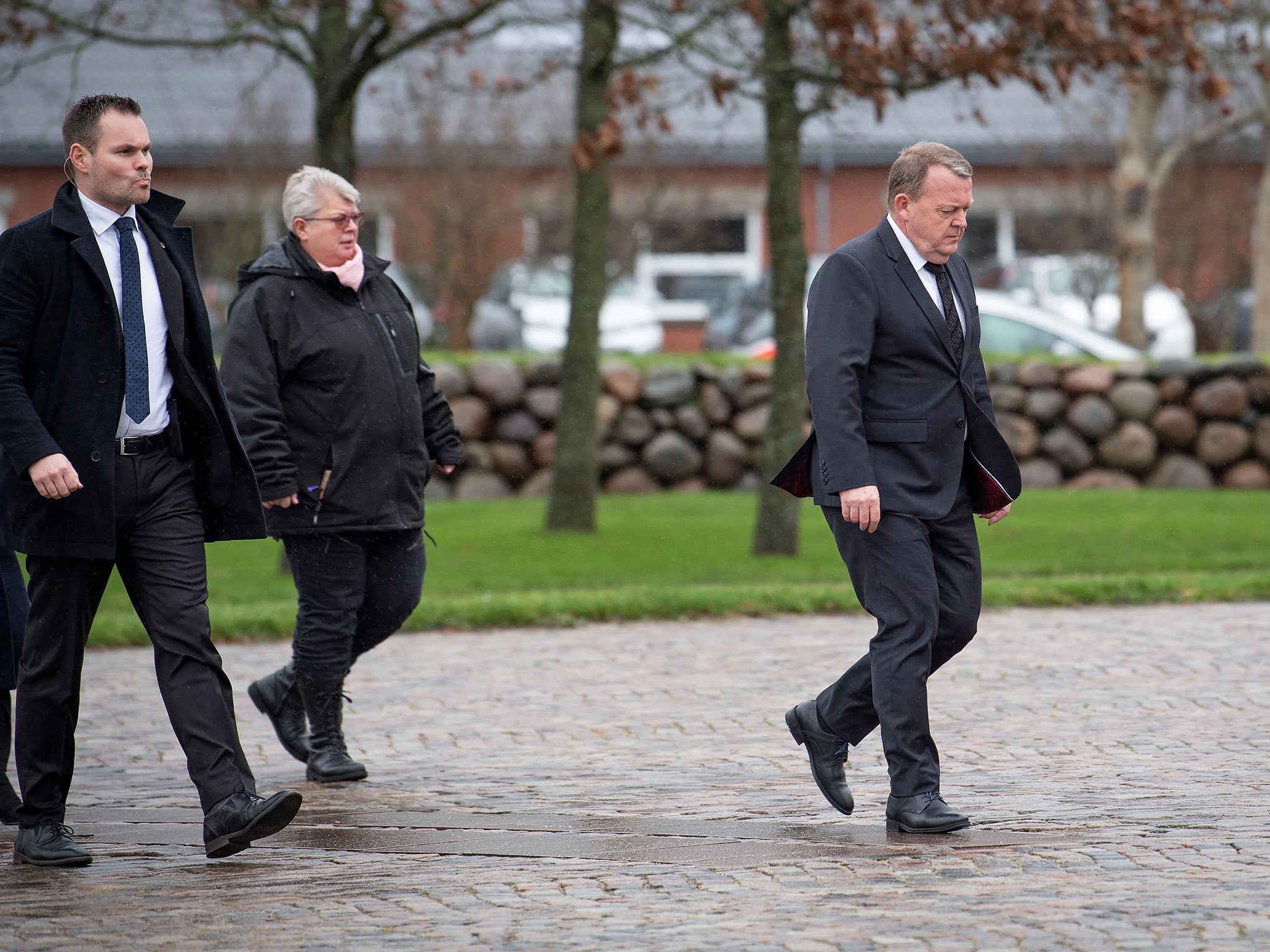 Danish Prime Minister Lars Lokke Rasmussen, right, attends the funeral of Danish student Louisa Vesterager Jespersen in Ikast, Denmark