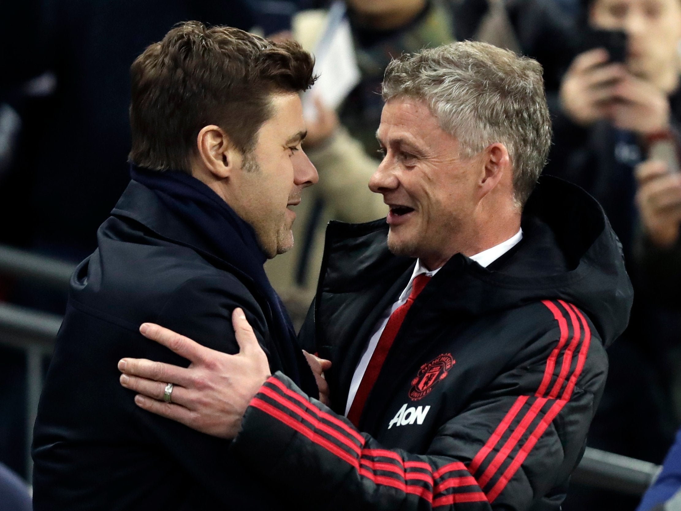 Manchester United caretaker manager Ole Gunnar Solskjaer greets Tottenham manager Mauricio Pochettino