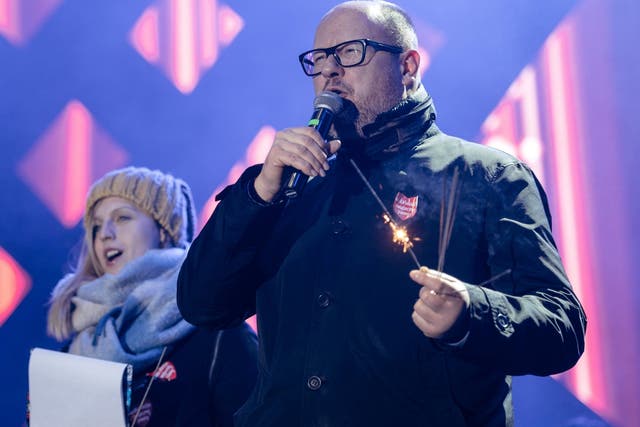 Adamowicz speaks on stage at the charity event where he was fatally stabbed on 13 January