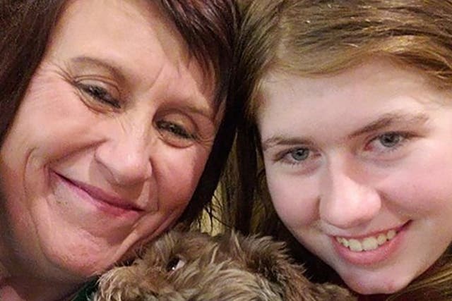 This photo provided by Jennifer Smith and used as her new Facebook proflie picture, shows 13 year old Jayme Closs (R), her aunt/godmother Jennifer Naiberg Smith (L) and Molly the dog posing together after being reunited on January 11 2019.