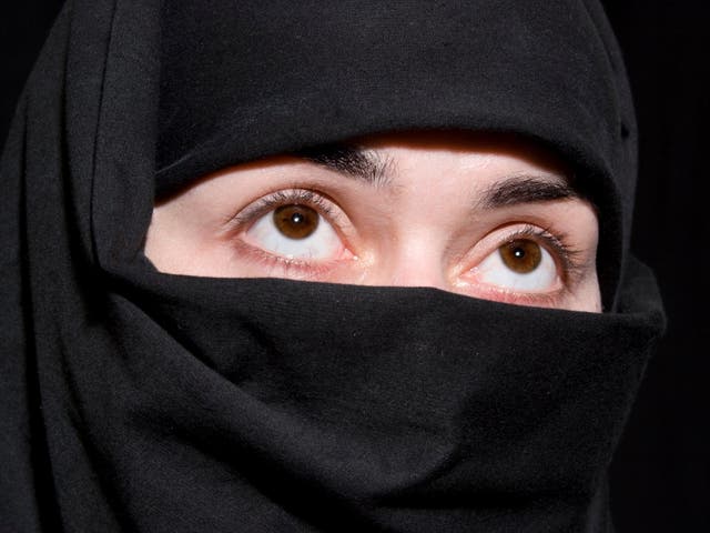 A woman wears a niqab