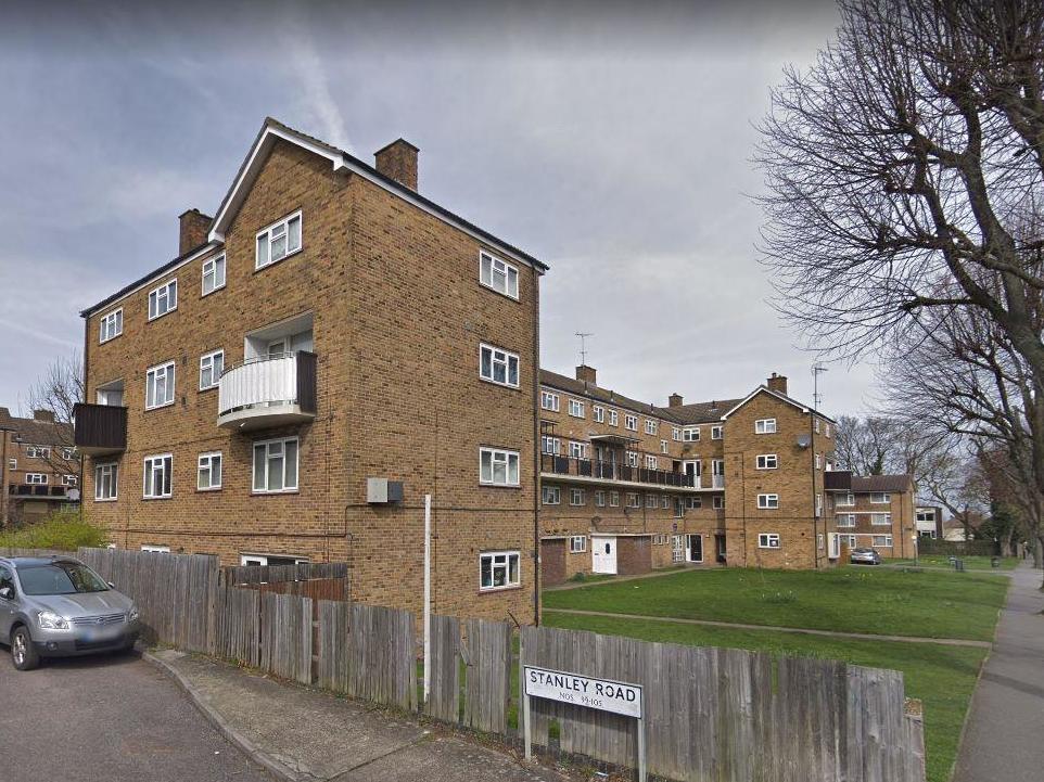 A man has been arrested after allegedly attempting to push a police officer from a third-floor balcony in Stanley Road, Carshalton, south London