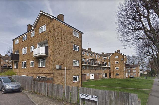 A man has been arrested after allegedly attempting to push a police officer from a third-floor balcony in Stanley Road, Carshalton, south London
