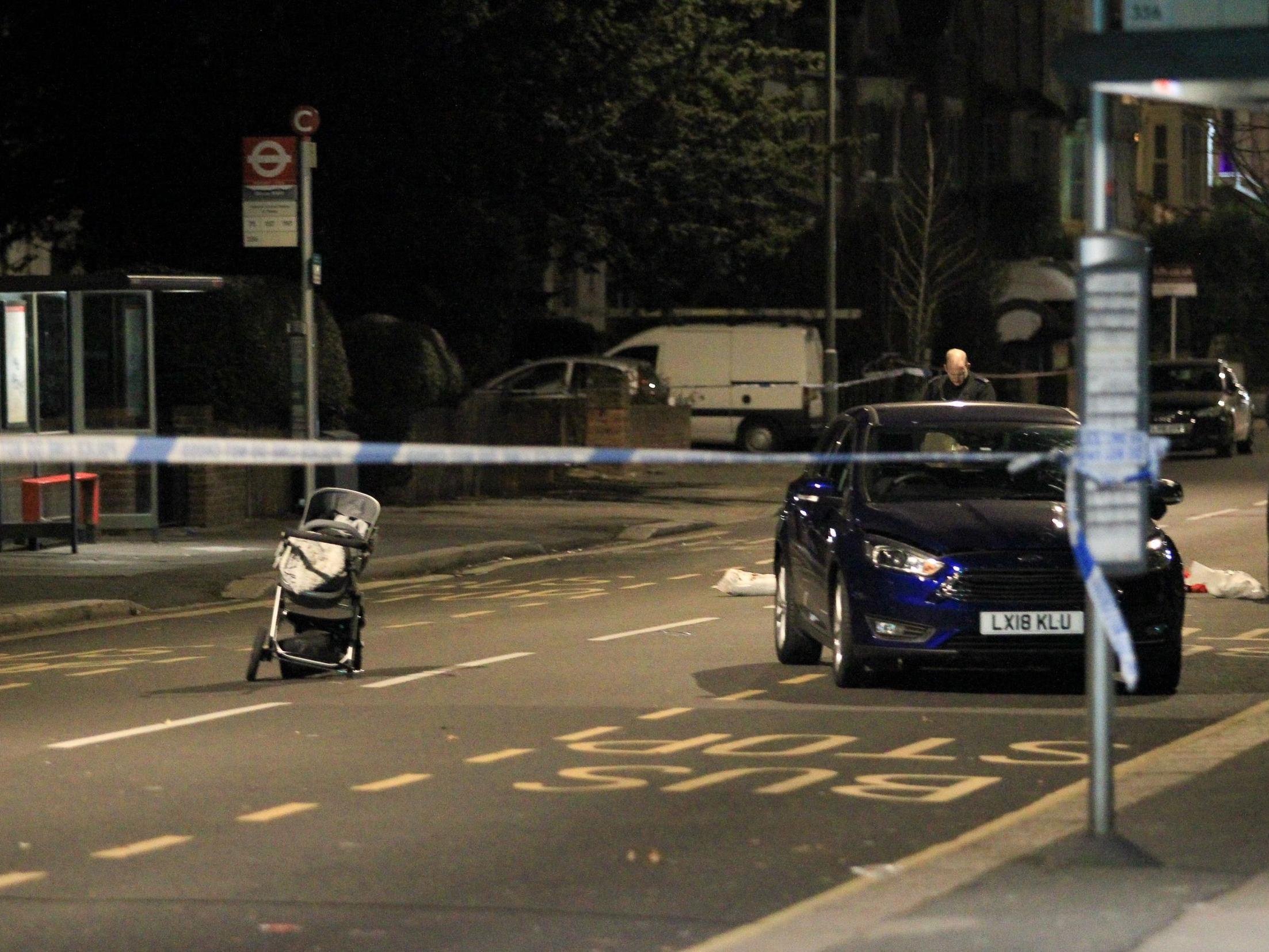 A pram sits in the middle of the road following the crash in Croydon Road, Penge