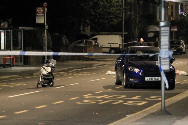 A pram sits in Croydon Road, Penge, after a mother was hit and killed by a Ford Mondeo