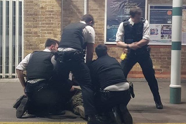 Officers discharged a Taser as they detained a man on the platform at the station.