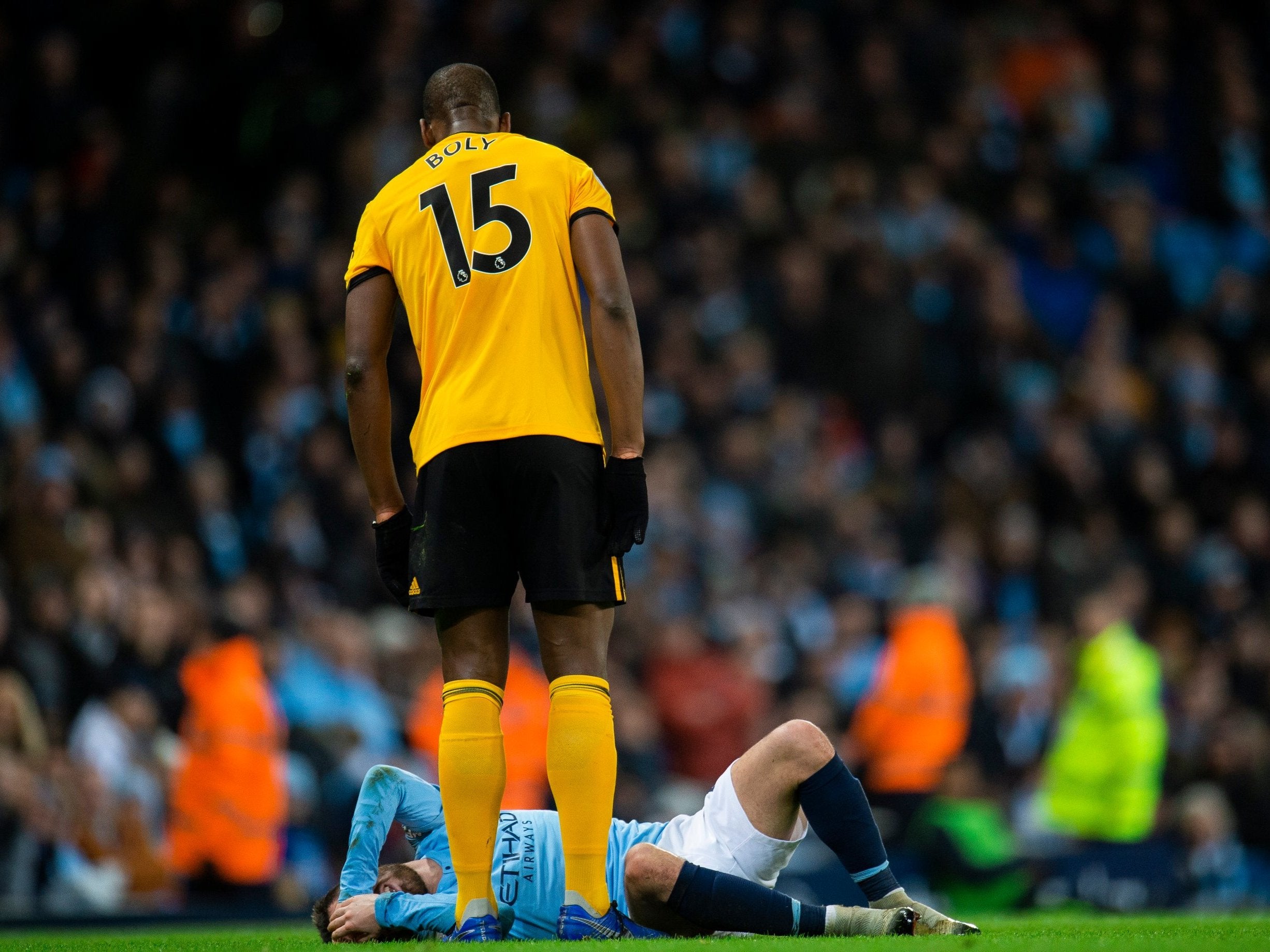 Wolverhampton Wanderers Willy Boly stands over Manchester City's Bernardo Silva