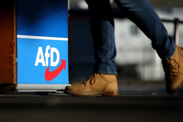 A member of the right-wing Alternative for Germany (AfD) political party arrives for the AfD congress