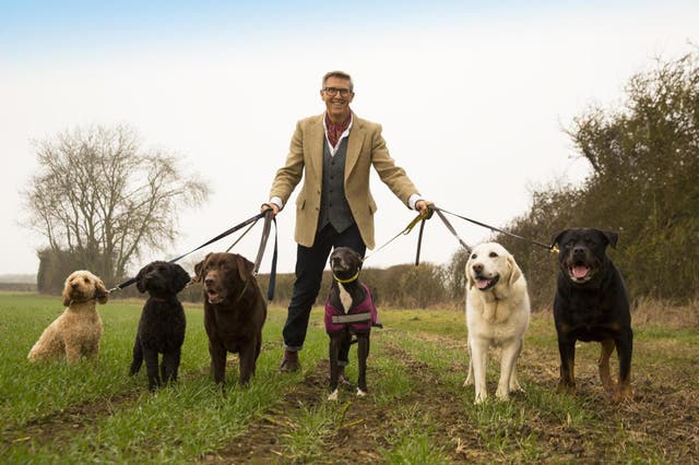 Graeme Hall accompanied with six dogs