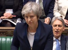 May suffers crushing Brexit vote defeat as MPs reject deal