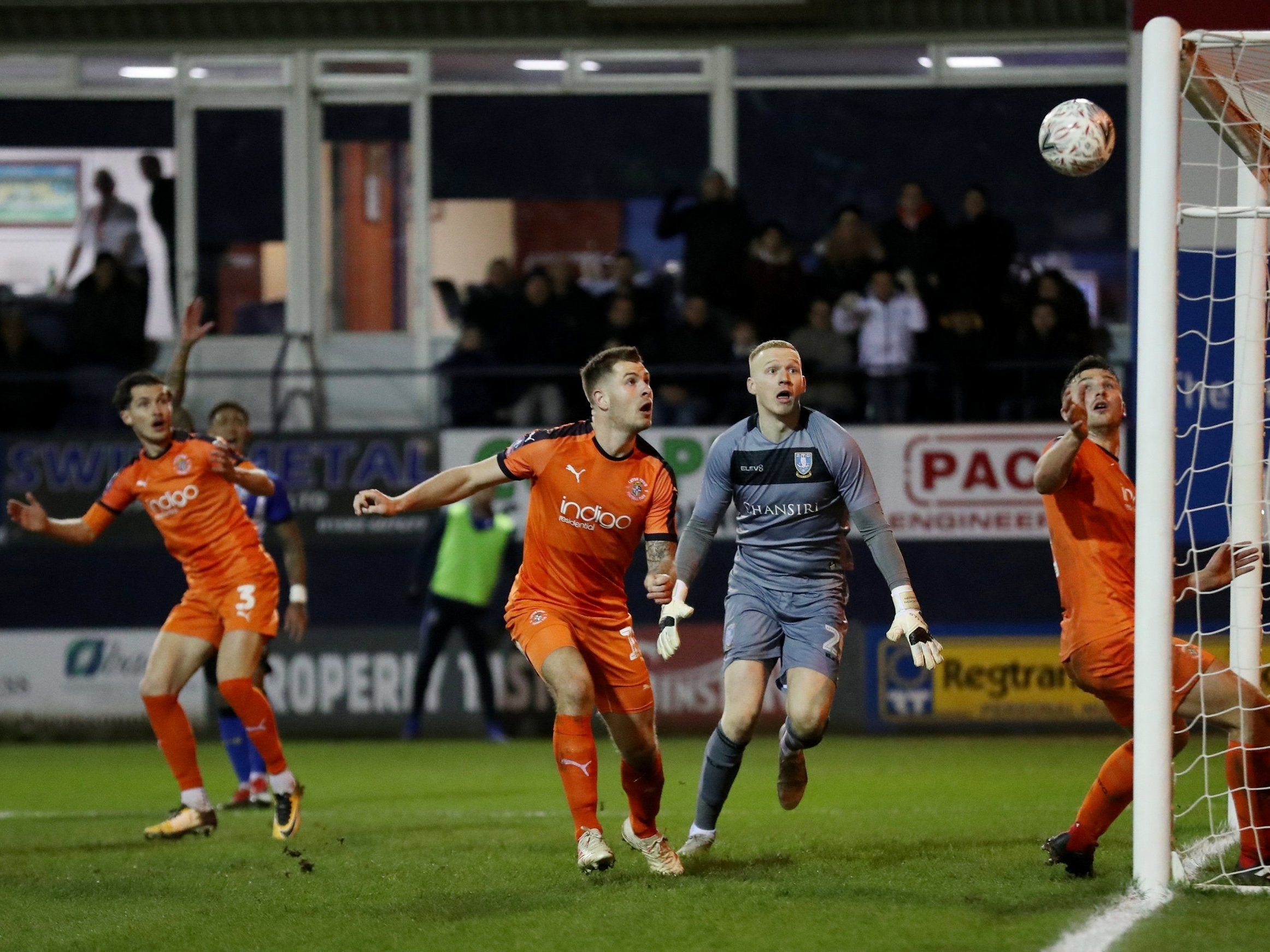 Luton Town's James Collins shoots against the post