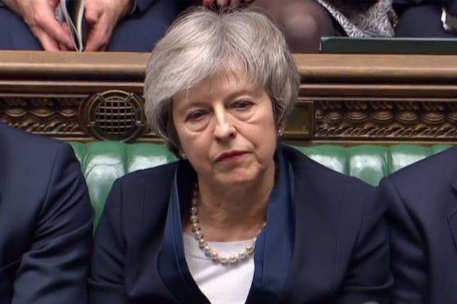 Theresa May reacts as Jeremy Corbyn informs MPs he has tabled vote of no confidence