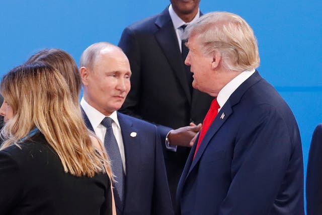 President Donald Trump and Russia's President Vladimir Putin as they gather for a group photo at the start of the G20 summit, Buenos Aires, Argentina. 30 November 2018.