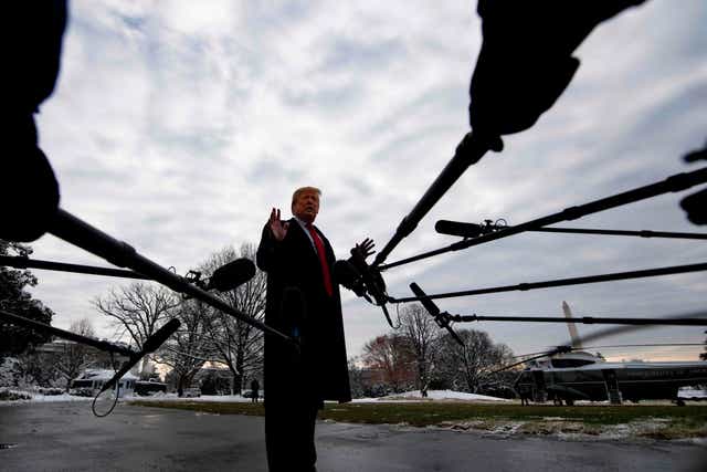 US President Donald Trump speaks to the media as he departs the White House in Washington, DC, 14 January 2019 en route to New Orleans, Louisiana to address the annual American Farm Bureau Federation convention. Mr Trump said Monday he has "never worked for Russia."