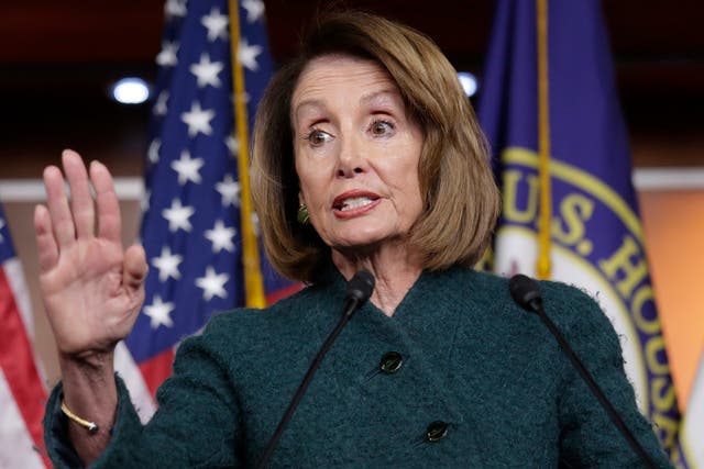 The photo of Nancy Pelosi used in the article was taken while she was announcing proposed legislation to expand background checks for firearms purchases