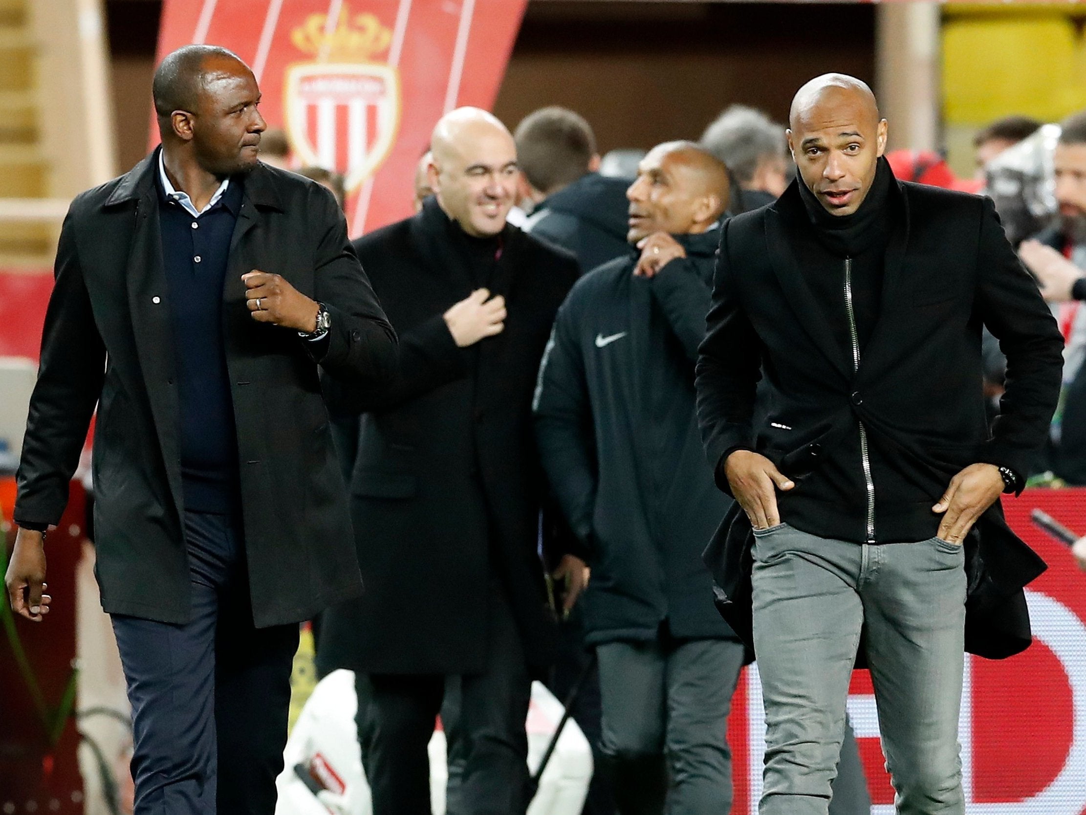 Thierry Henry and Patrick Vieira stride on to the pitch before kick-off
