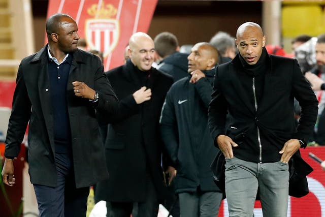 Thierry Henry and Patrick Vieira stride on to the pitch before kick-off