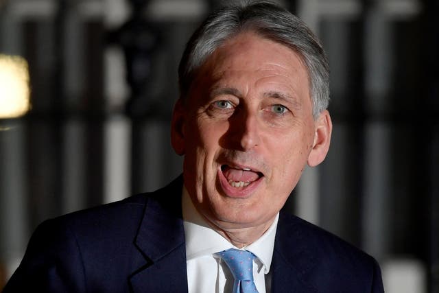 Philip Hammond arrives in Downing Street after Theresa May survives a confidence vote