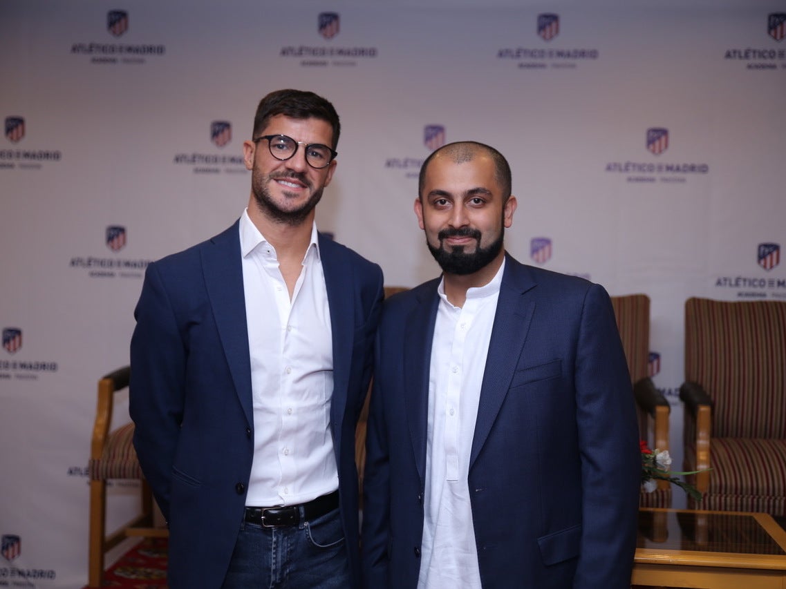 Atletico Madrid's international academy manager Fernando Lobete (L) with Lahore Academy's CEO Muhammad Atta Tanseer