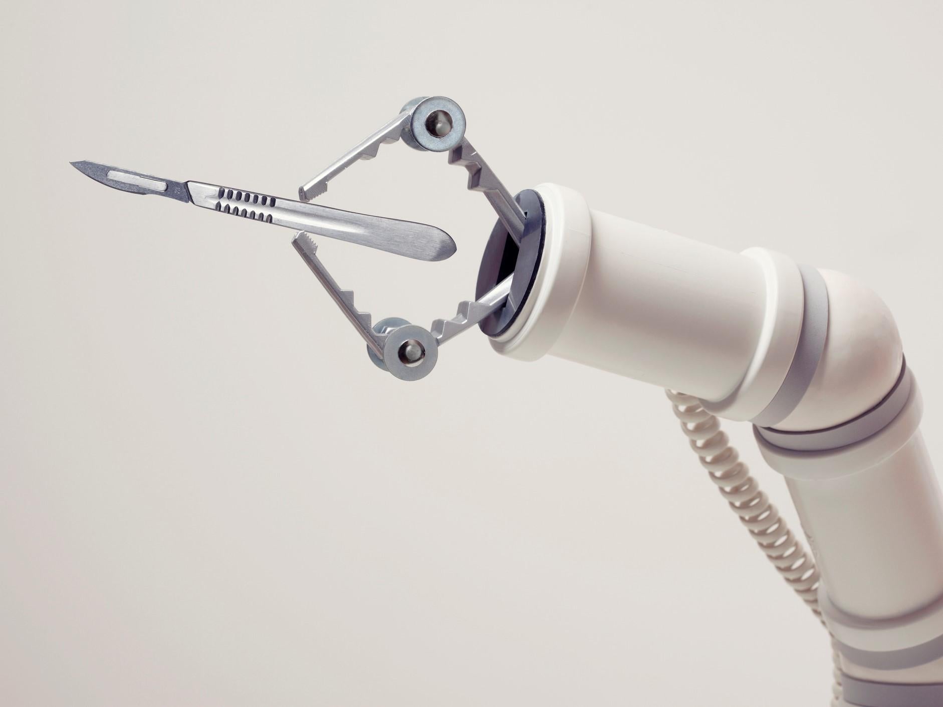 A robotic arm with a scalpel