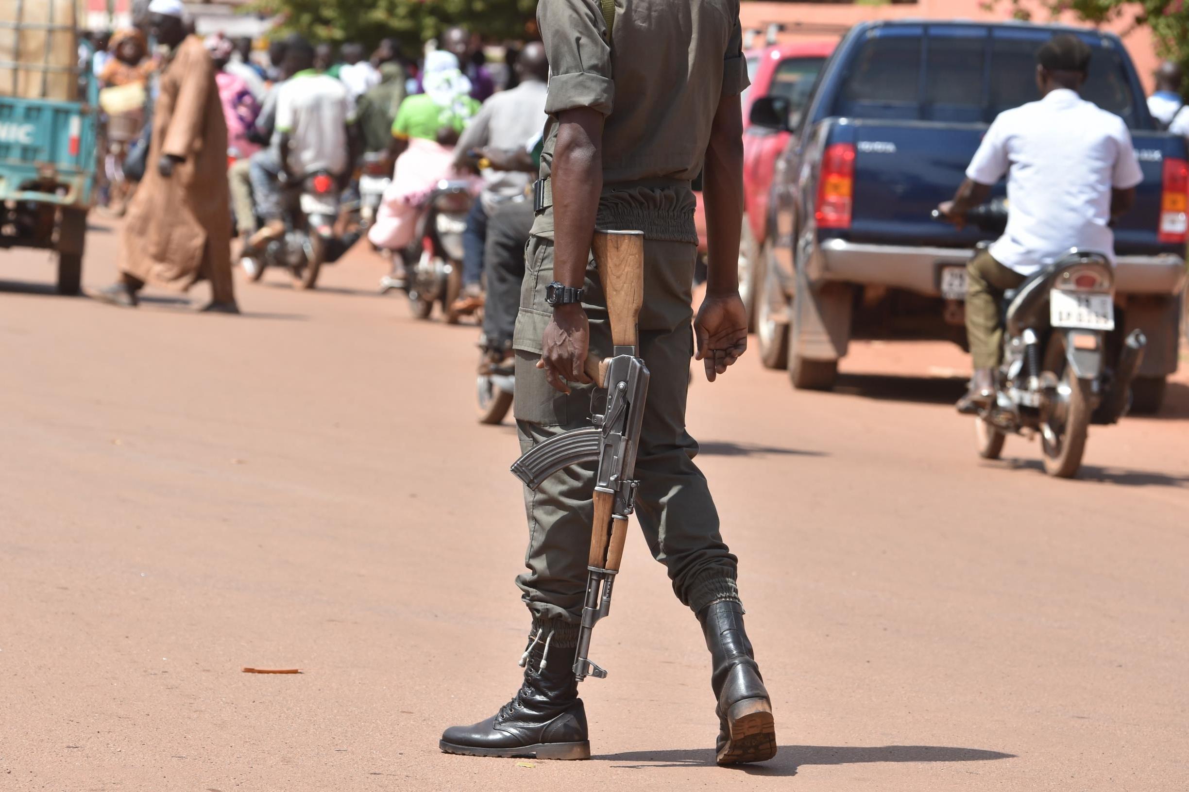 A picture taken on October 29, 2018 shows a policeman patrolling in the center of Ouahigouya, eastern Burkina Faso. Parts of the North and East of Burkina Faso are, if not controlled, hassled by Jihadists.