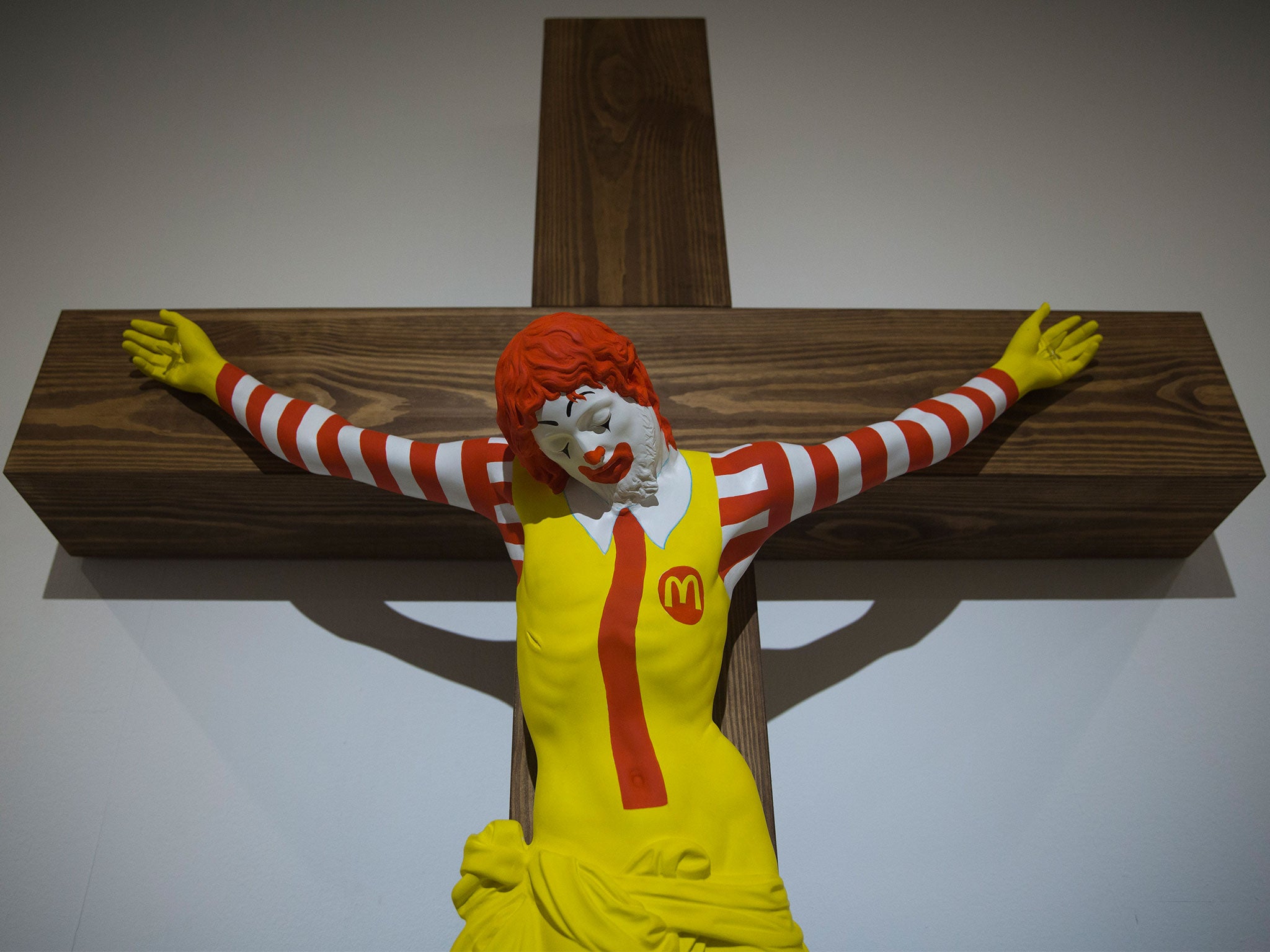 McJesus, by Finish artist Jani Leinonen, features a depiction of fast food mascot Ronald McDonald on a crucifix