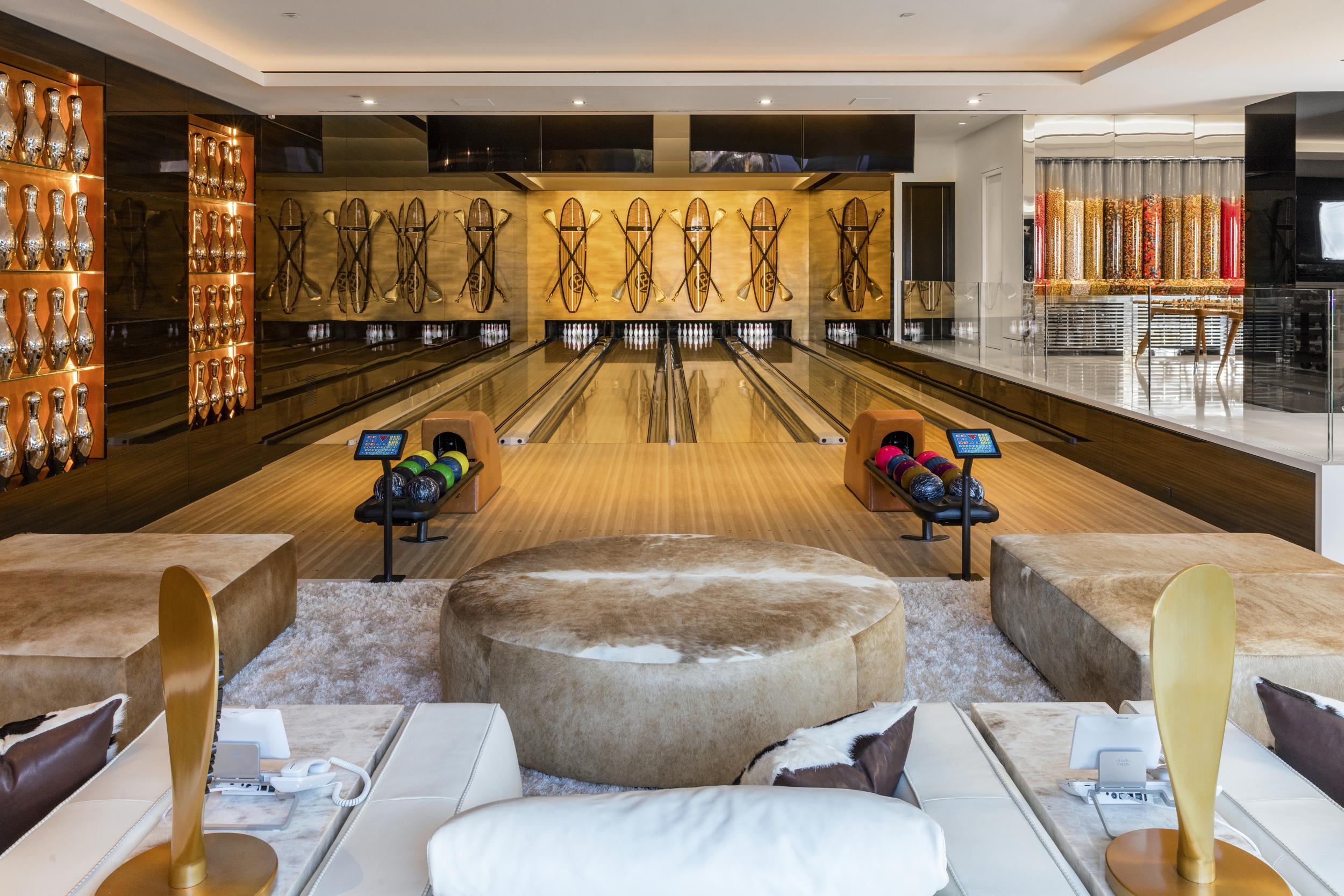 The house includes a bowling alley (Berlyn Photography)