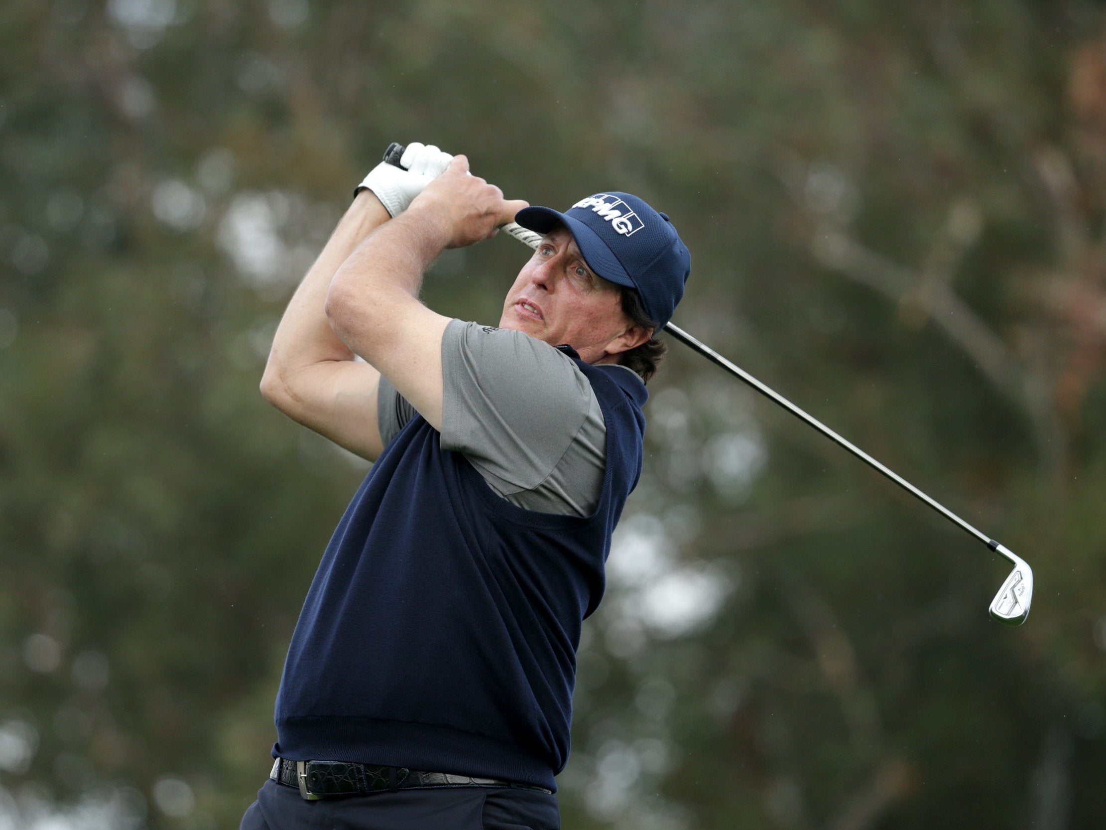 Phil Mickelson leads the Desert Classic by three shots after a career best-equalling 60