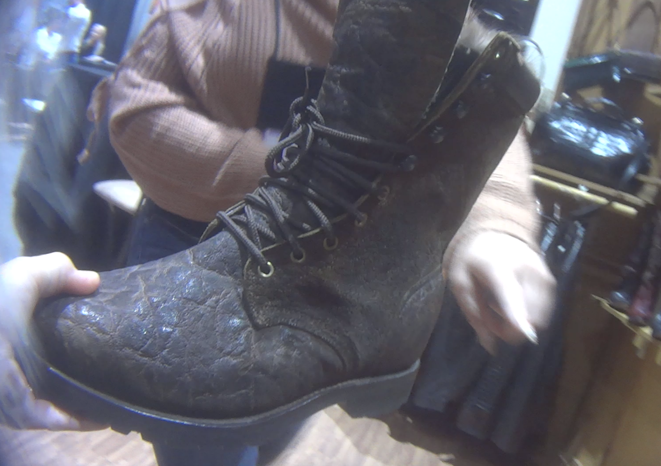 A boot sample made from elephant skin is displayed for custom ordering