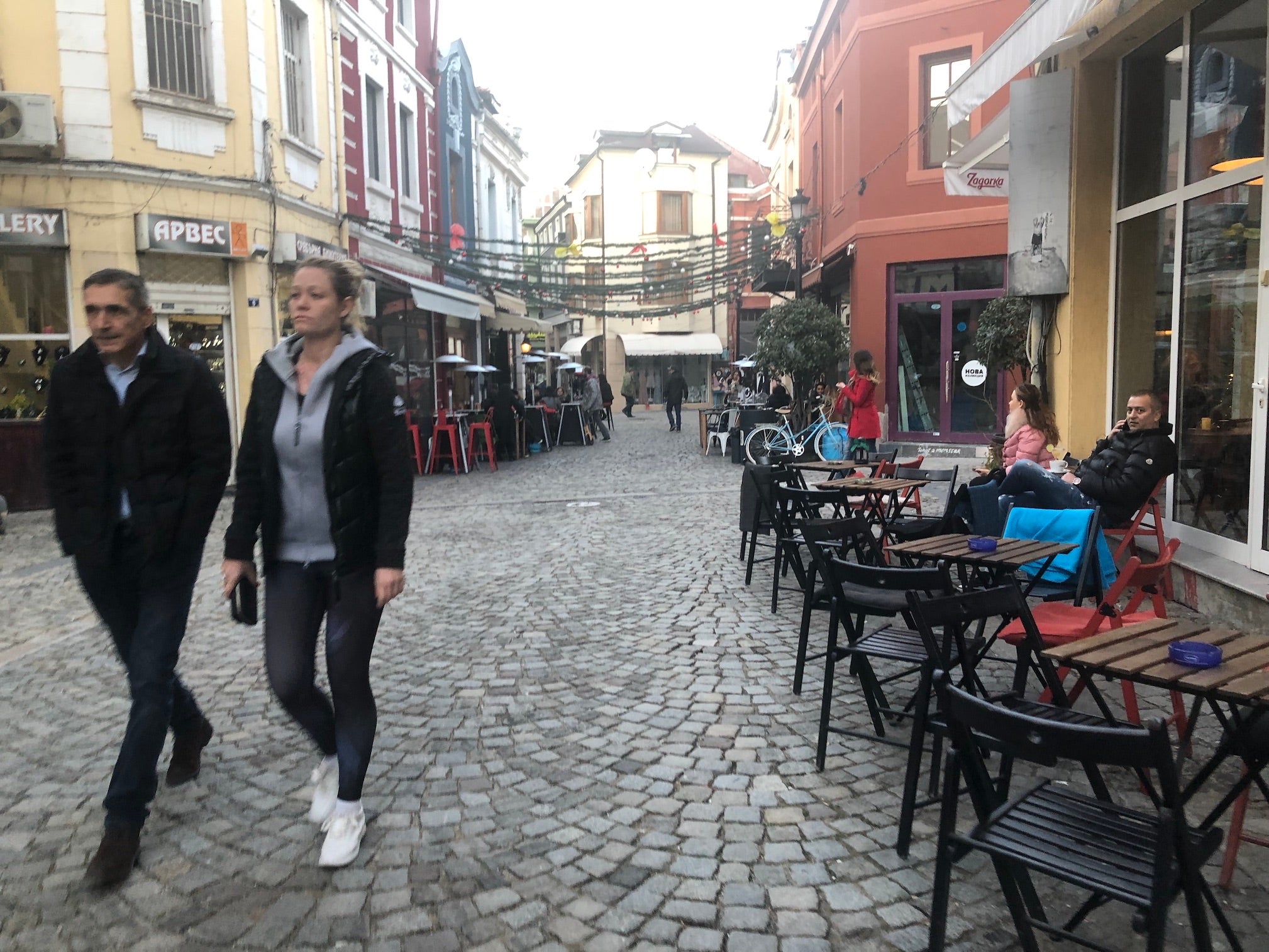 People walk through The Trap, a neighbourhood of shops and cafes