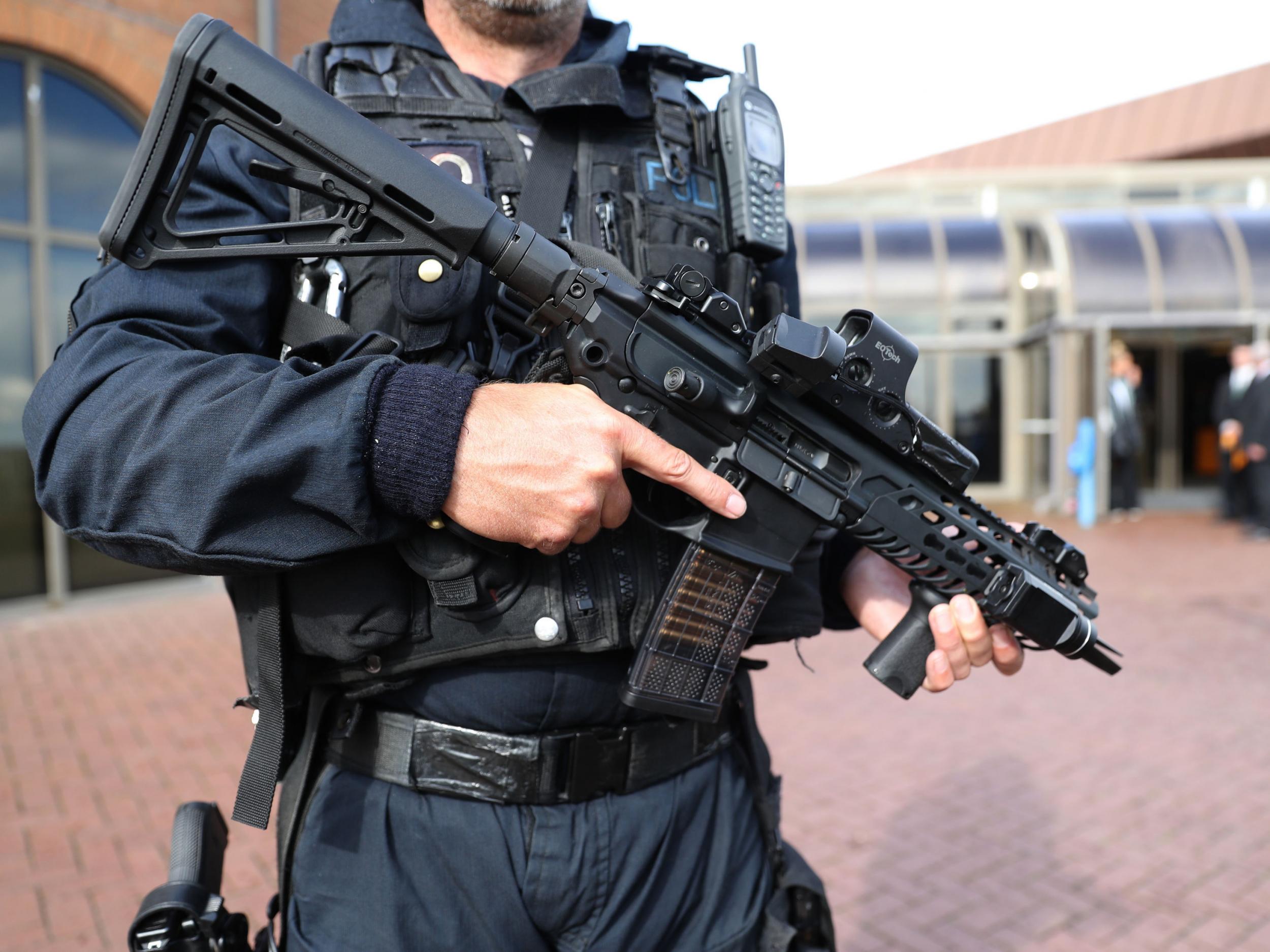An armed police officer on patrol