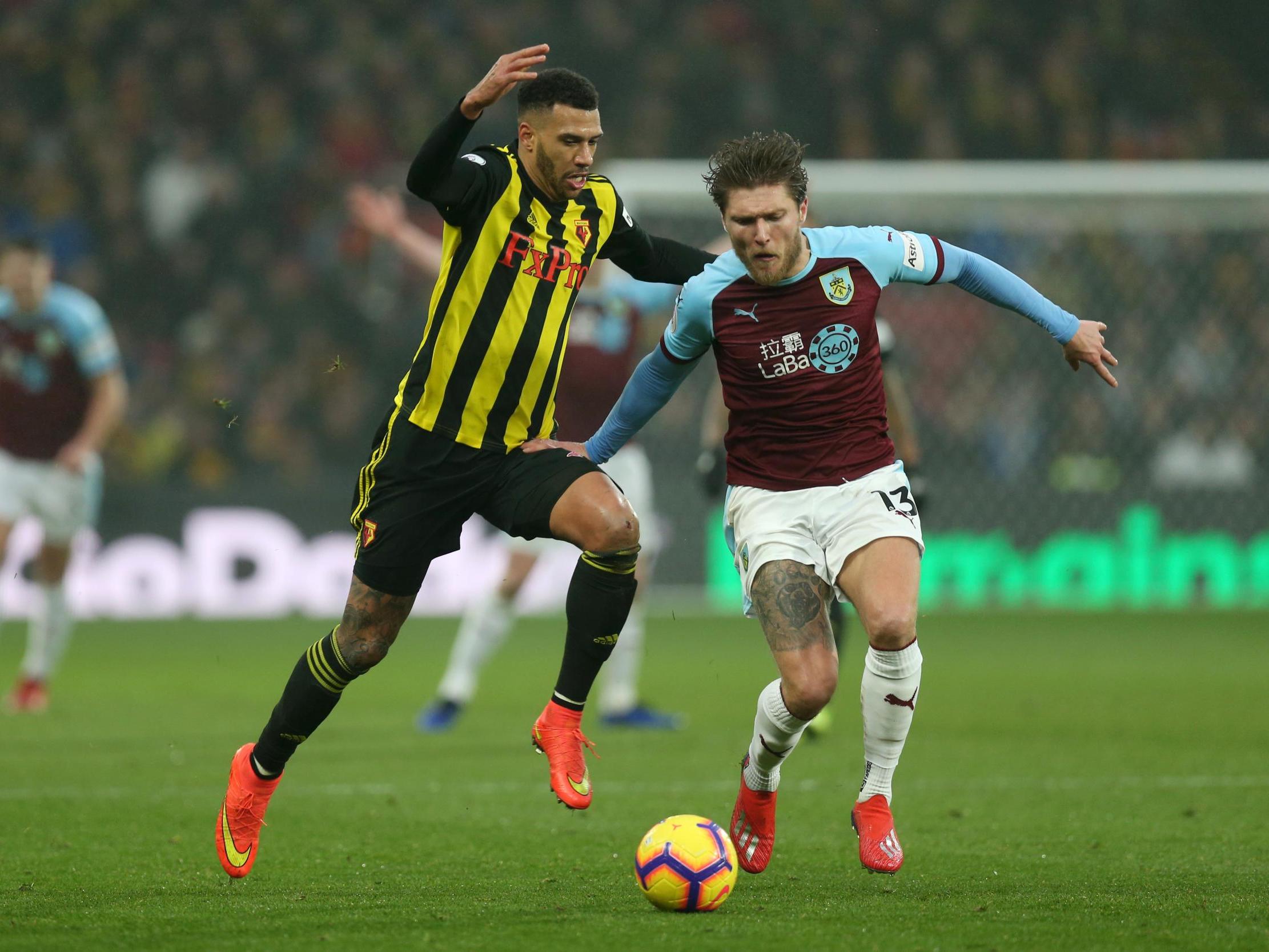Jeff Hendrick and Etienne Capoue battle for the ball
