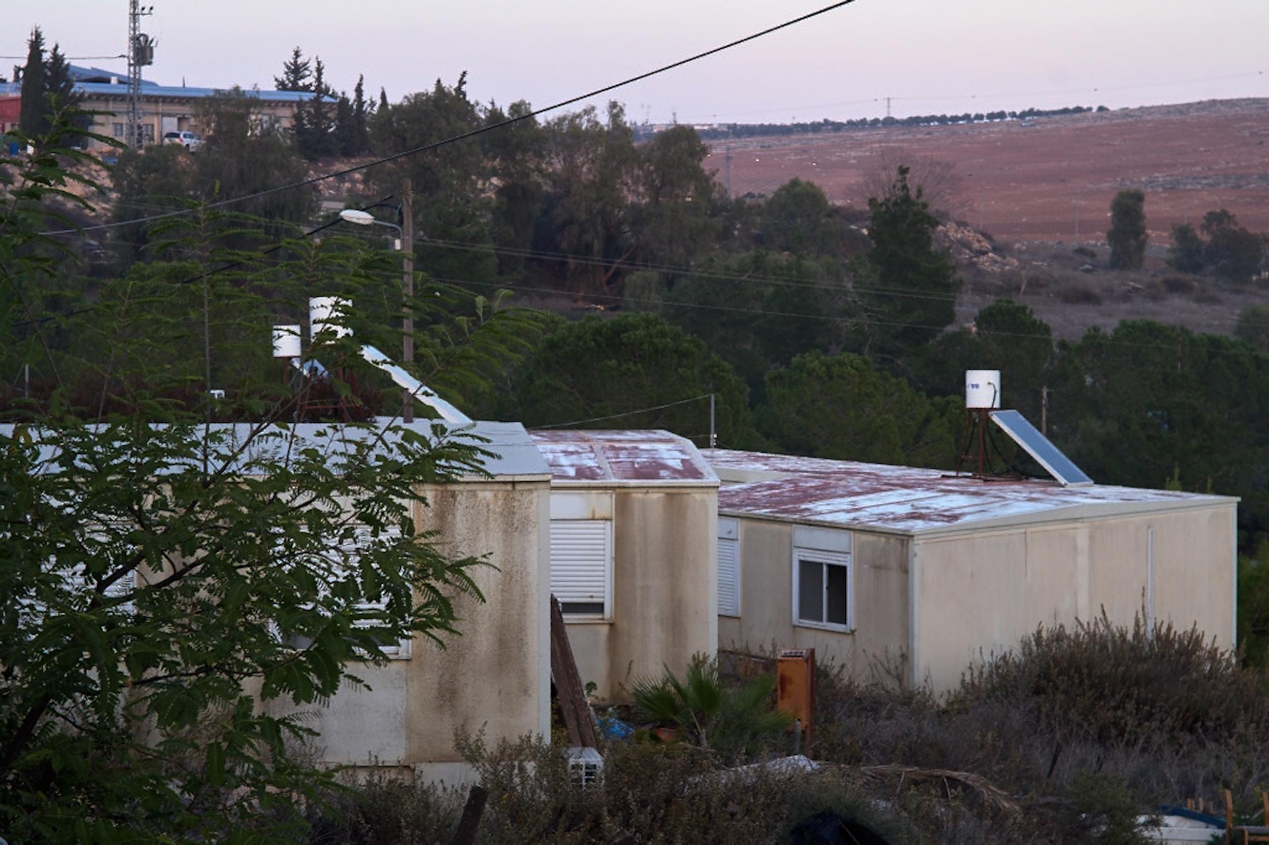 Susya Israeli settlement, where each house has lush green gardens