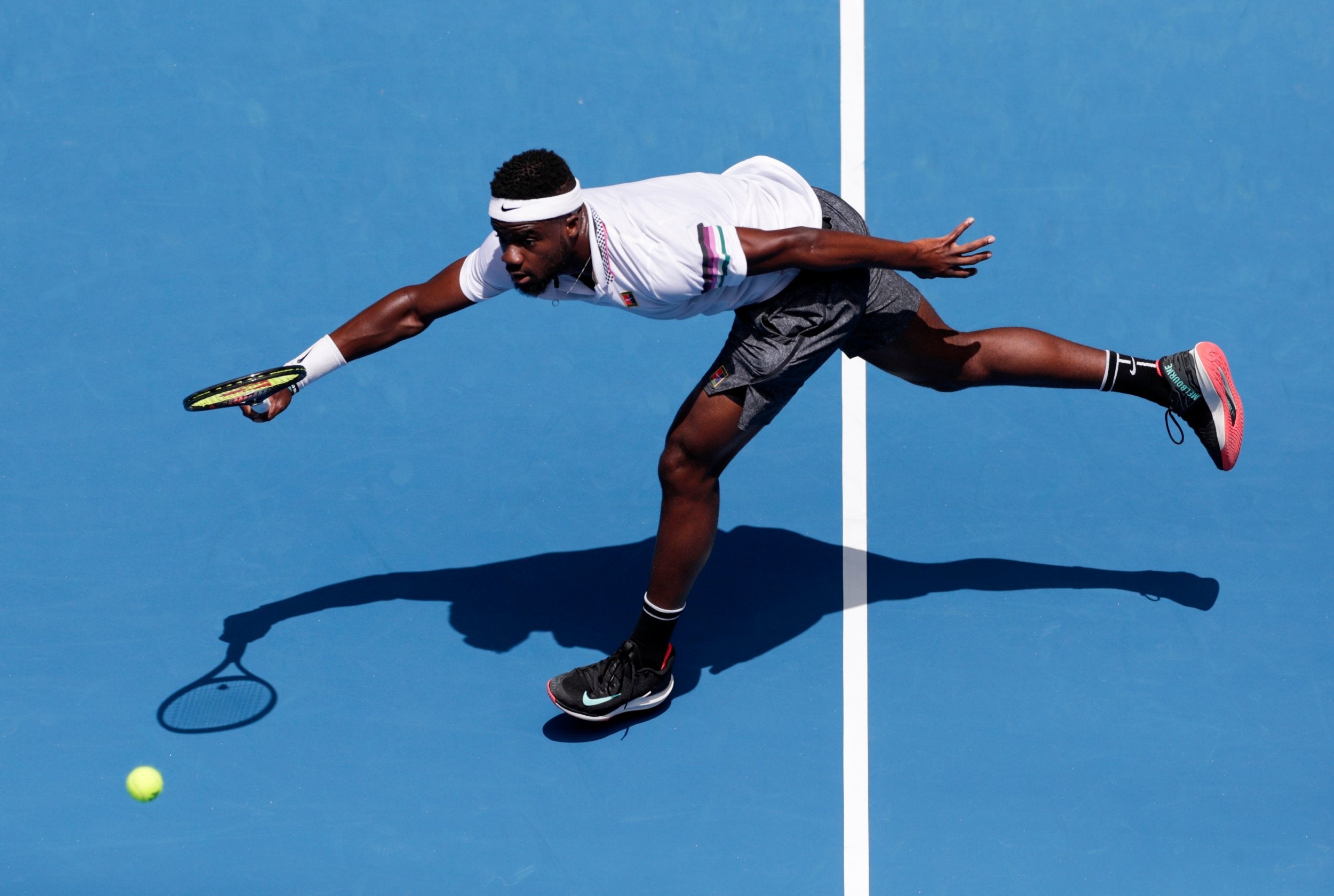 Frances Tiafoe returns vs Grigor Dimitrov