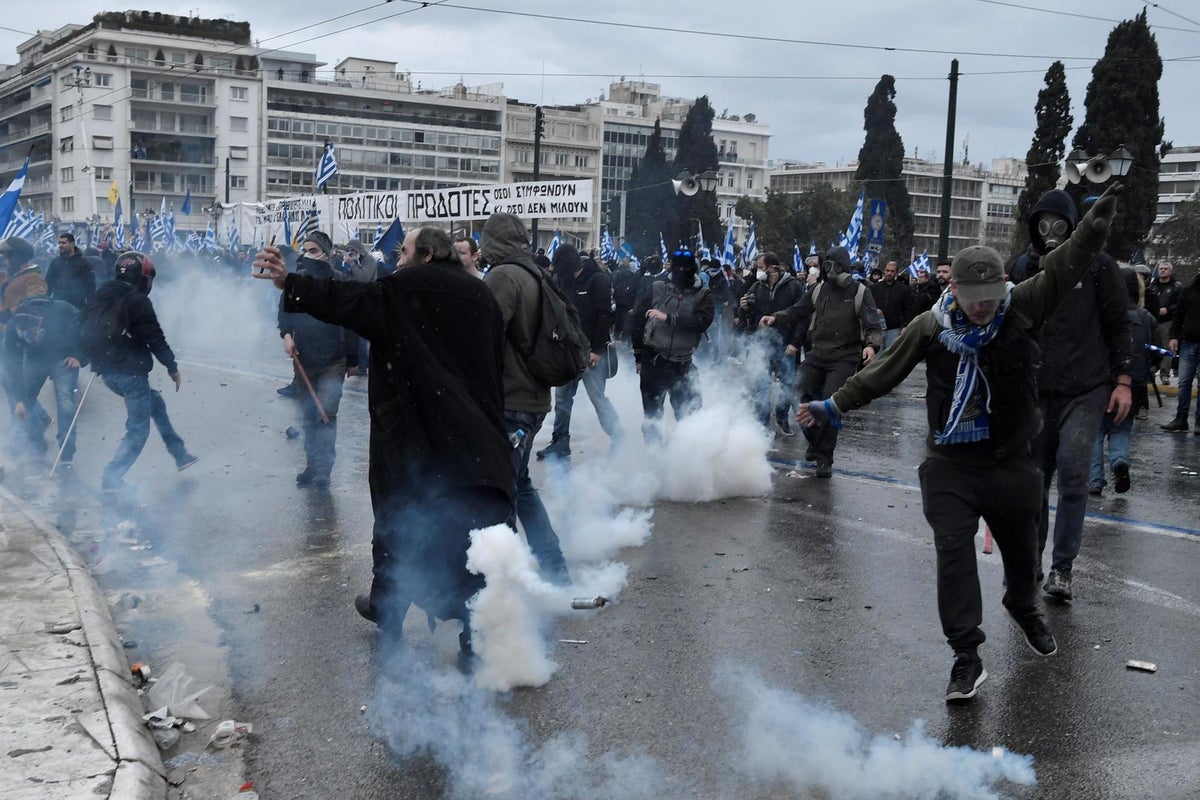 Athens riots: Clashes as 60,000 protesters march in Greece against ...