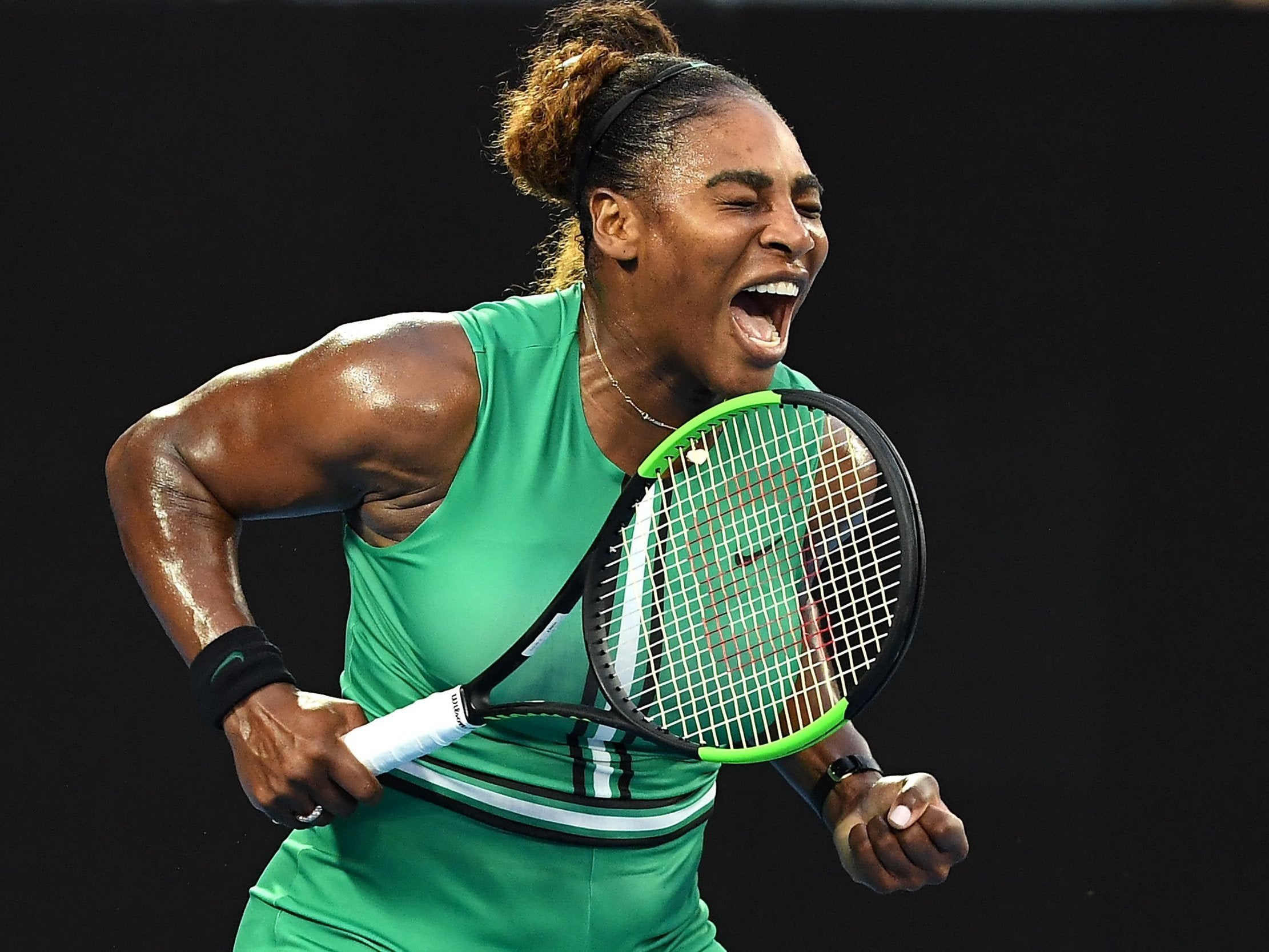 Serena Williams celebrates after defeating world No 1 Simona Halep to reach the Australian Open quarter-finals