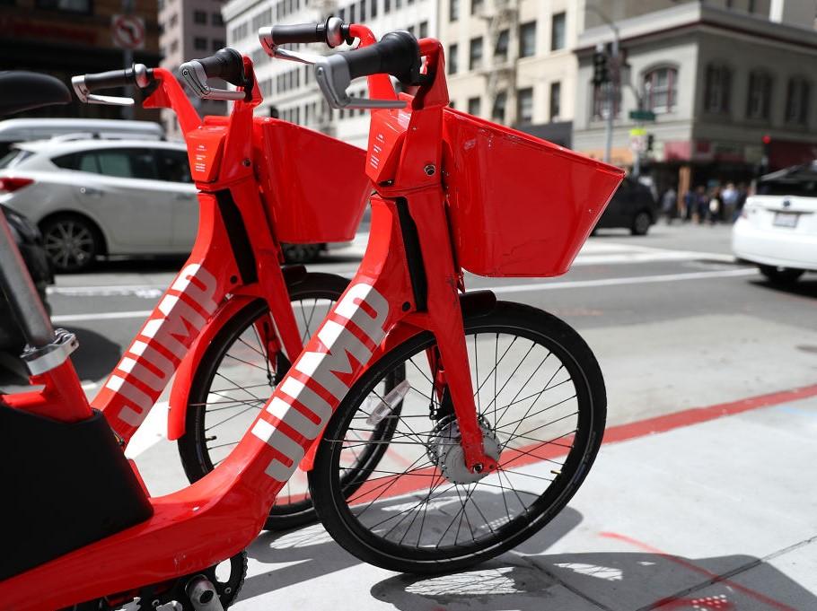 Jump bikes parked on a street corner on April 12, 2018 in San Francisco, California