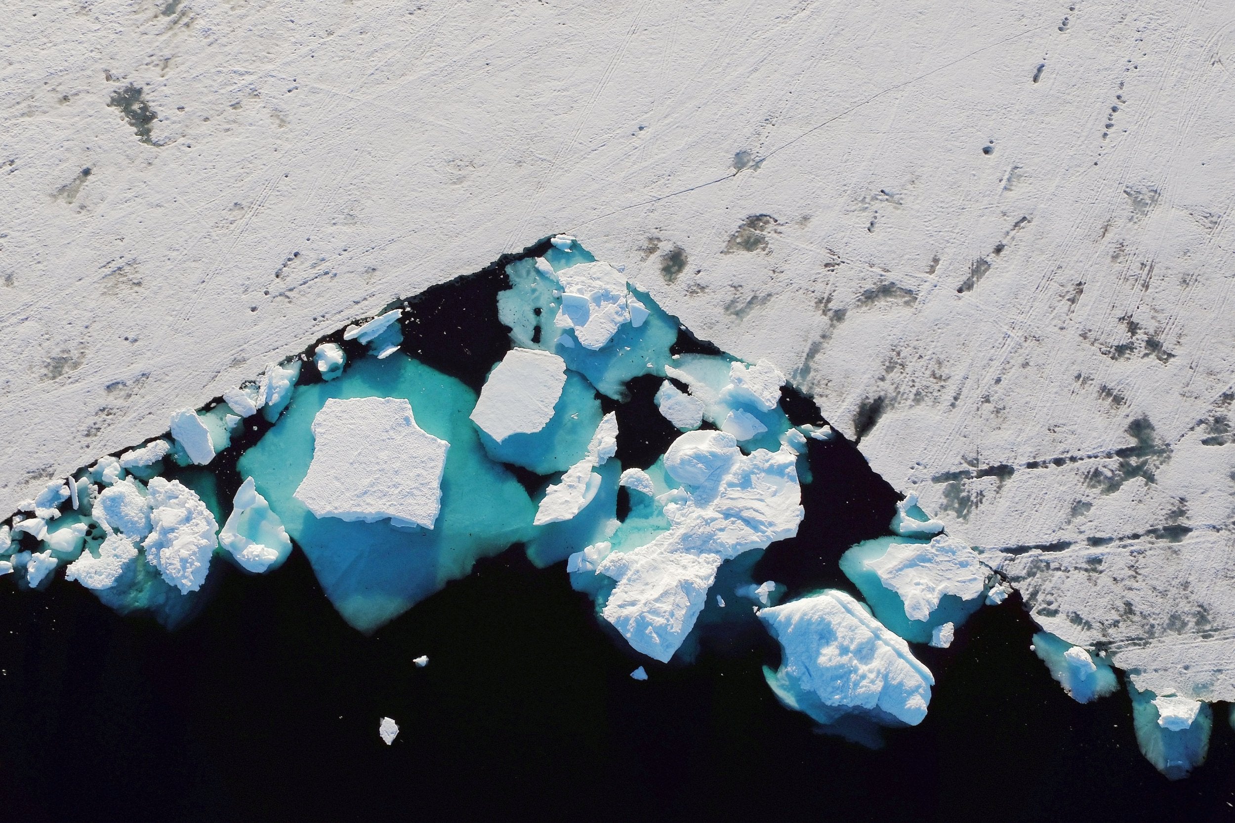 Ice in a fjord in southeastern Greenland last June. A new study shows Greenland lost around 280bn tons of ice per year between 2002 and 2016, enough to raise the worldwide sea level by 0.03 inches every year