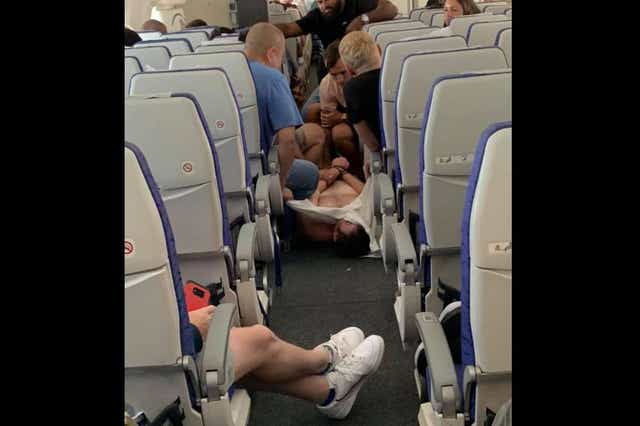 The passenger had to be pinned to the floor on a Scoot flight