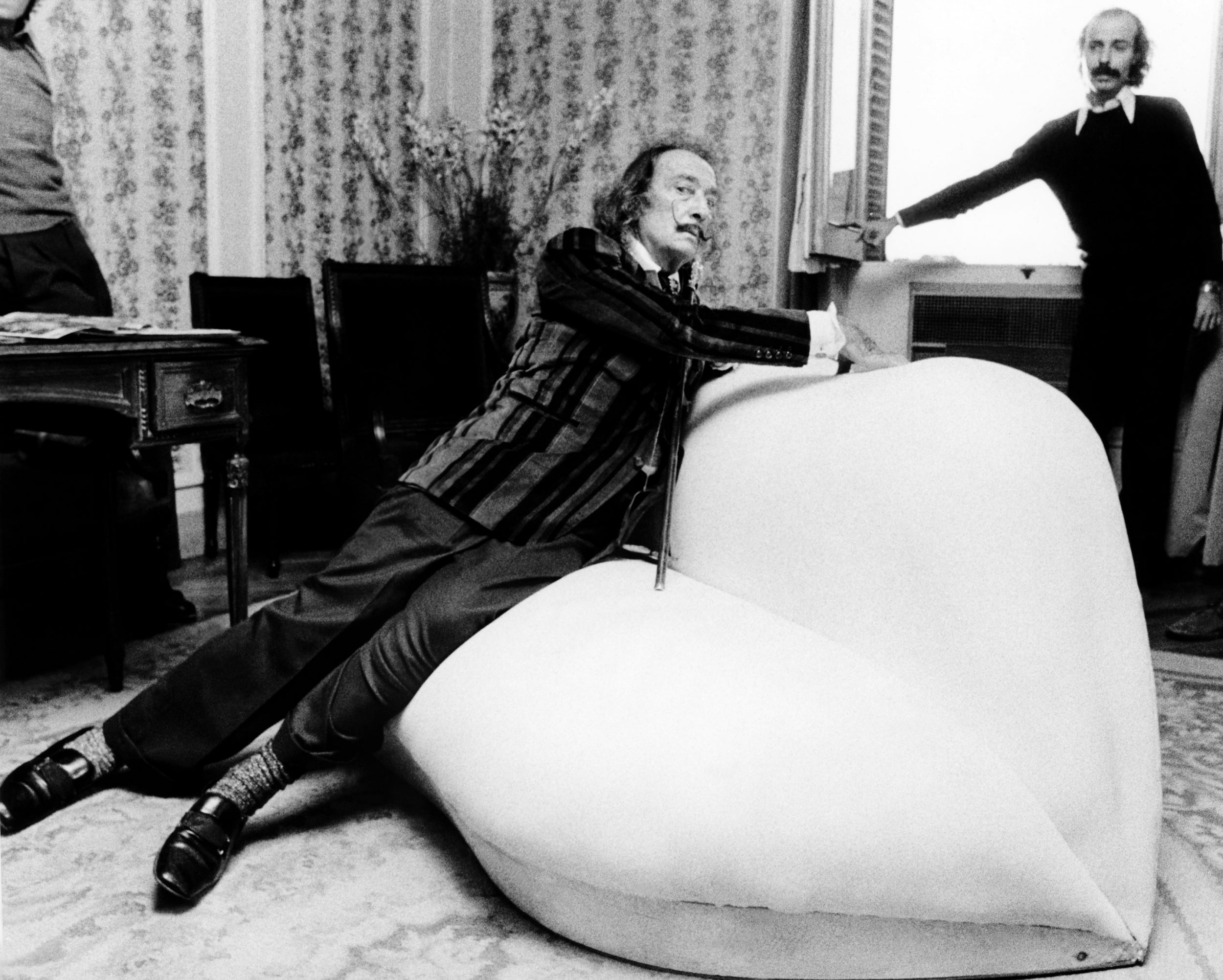 Dali on his famous red-satin sofa which he called ‘Mae West Lips’