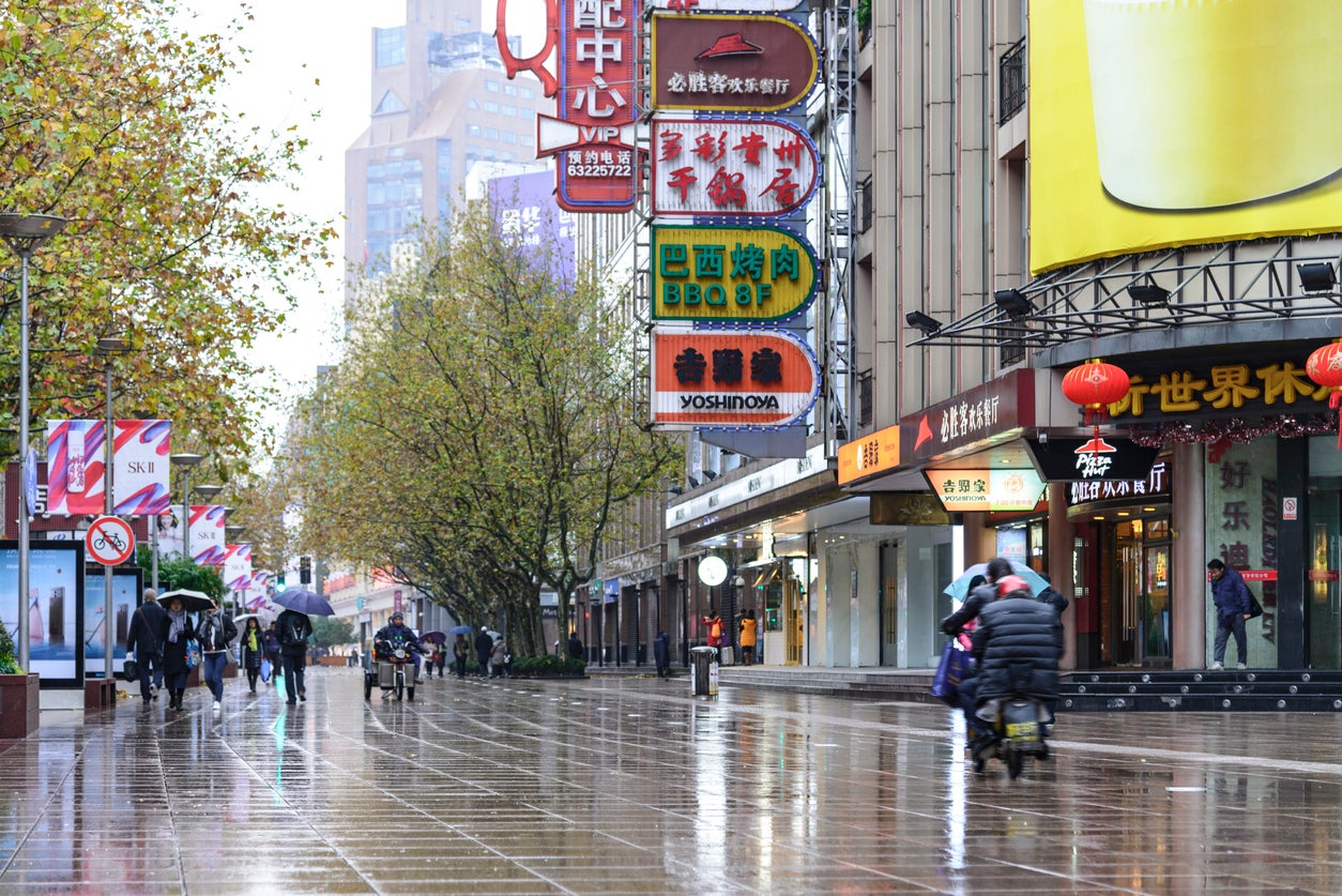 Explore areas like Nanjing East Road before the crowds arrive (Getty)