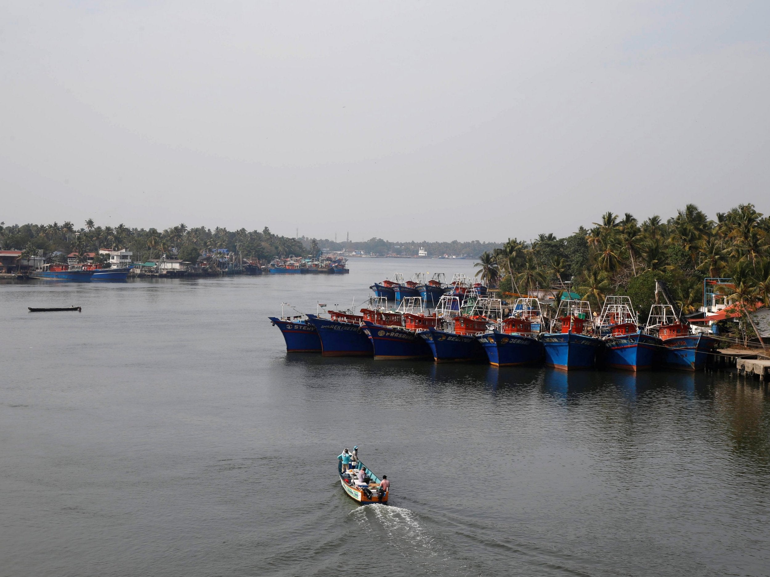 A fishing boat leaves the harbour at Munambam on the outskirts of Kochi in Kerala, India, on Monday