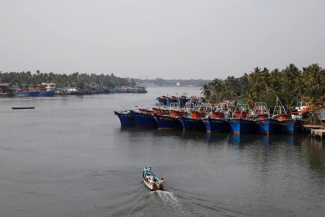 A fishing boat leaves the harbour at Munambam on the outskirts of Kochi in Kerala, India, on Monday