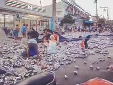 People scramble for free beer after truck overturns in Thailand