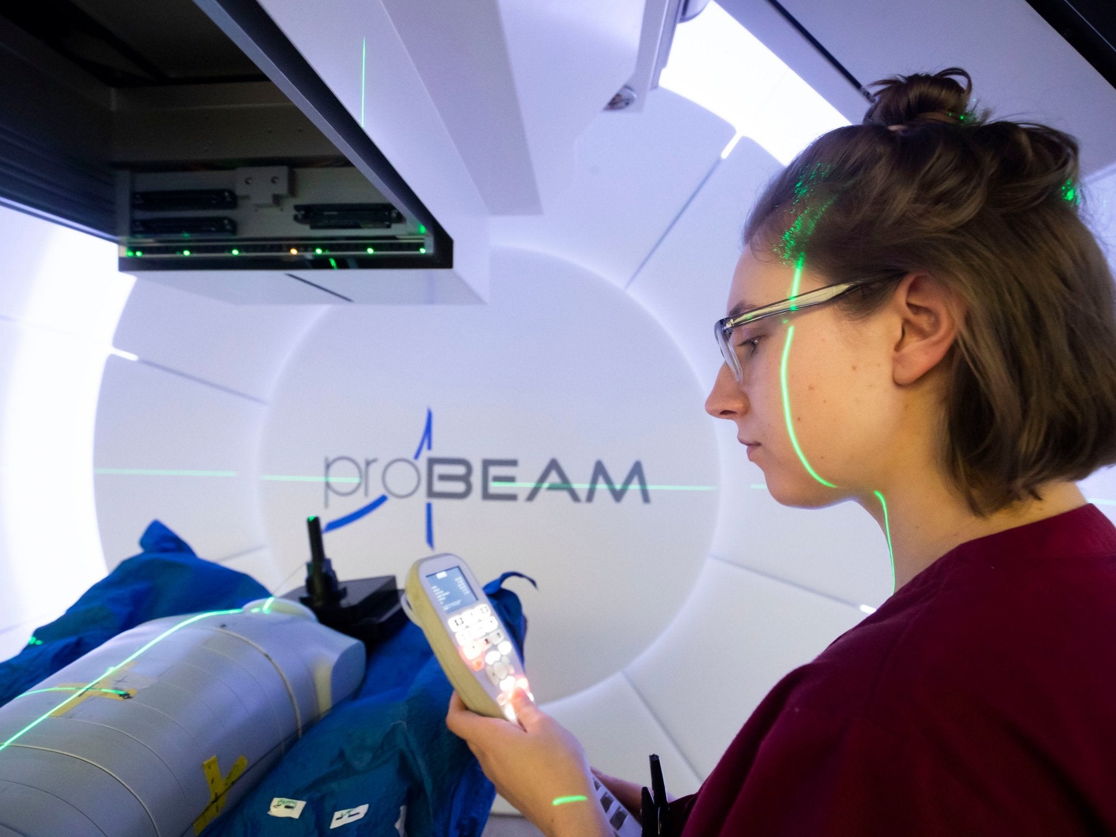 Radiographer Melissa Bentley with a test dummy as she demonstrates the NHS' new Proton Beam therapy centre at The Christie hospital in Manchester