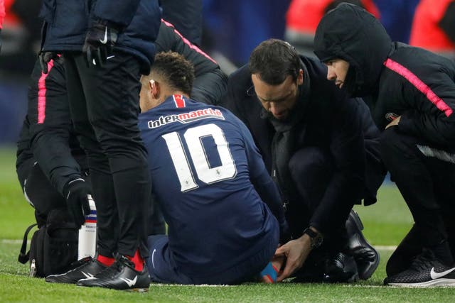 Paris St Germain's Neymar receives medical attention