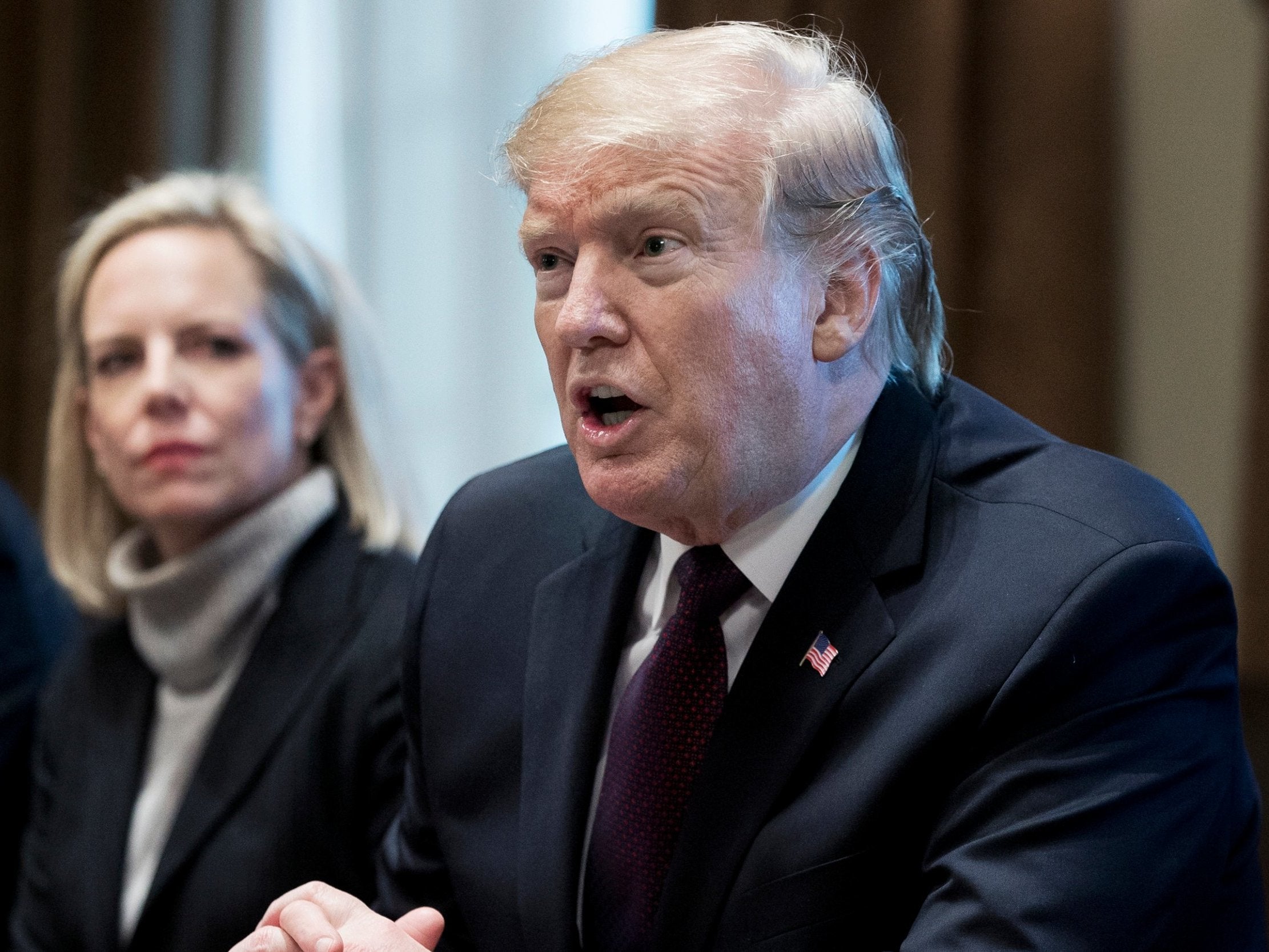 US President Donald Trump delivers remarks to members of the news media during a meeting on immigration policy