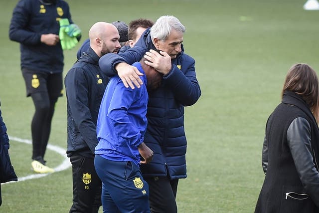 Nantes head coach Vahid Halilhodzic comforts Majeed Waris after news of the search for Emiliano Sala being called off