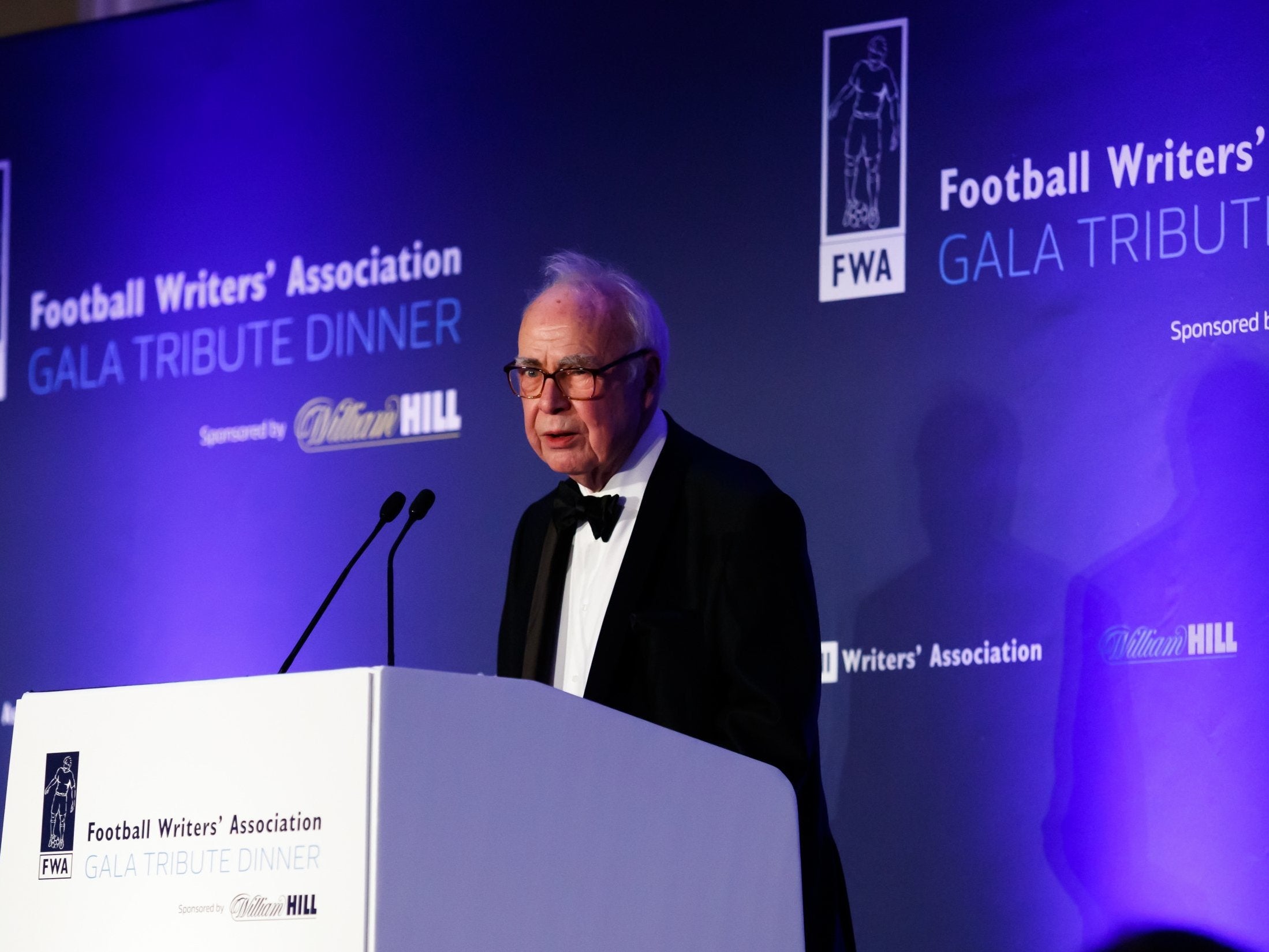 McIlvanney speaking at the Football Writers’ Association Gala Tribute Dinner in 2018 (PA Images)