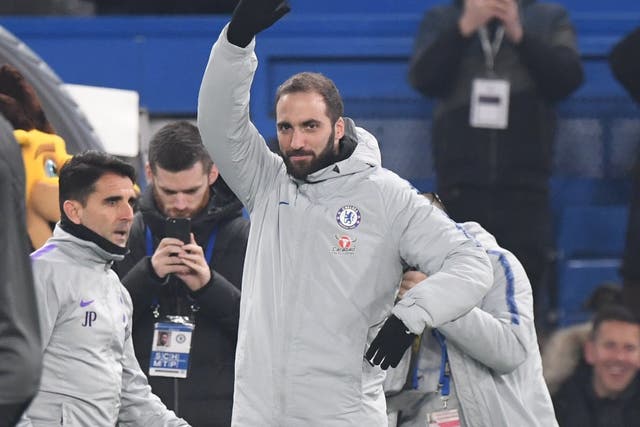 Gonzalo Higuain acknowledges the Chelsea fans after being unveiled